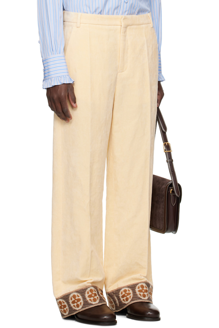 Flocked woven cotton-blend trousers.

· Belt loops
· Four-pocket styling
· Zip fly 
· Creased legs 
· Jacquard patterned trim at cuffs
· Full satin twill lining

Supplier color: Burro
