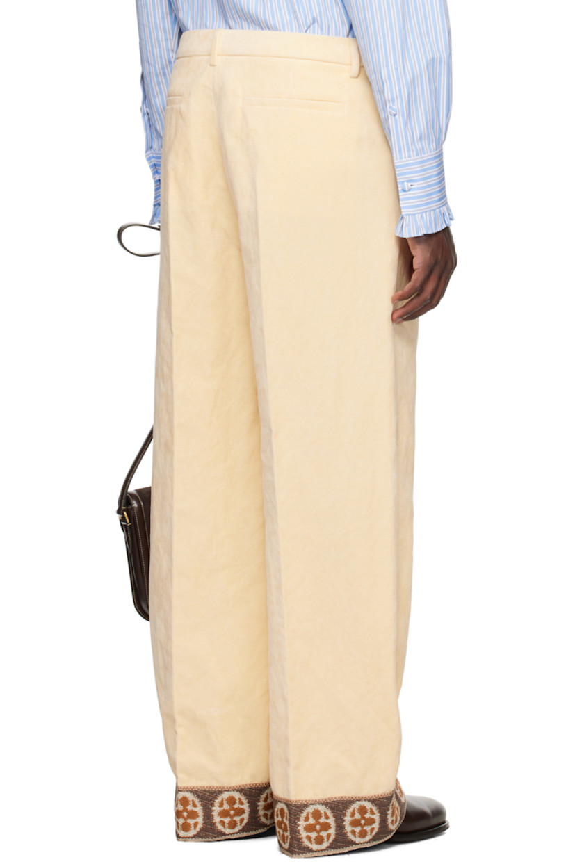 Flocked woven cotton-blend trousers.

· Belt loops
· Four-pocket styling
· Zip fly 
· Creased legs 
· Jacquard patterned trim at cuffs
· Full satin twill lining

Supplier color: Burro