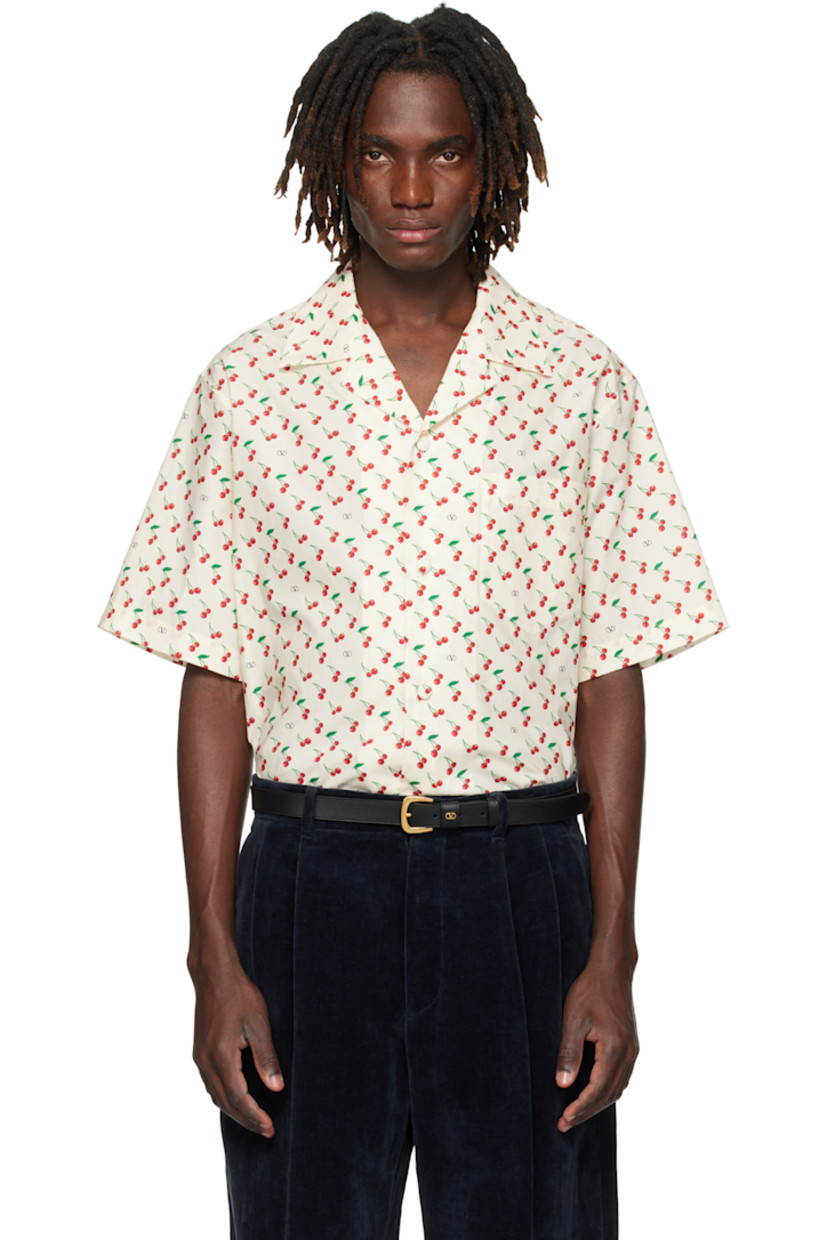 Cotton poplin shirt.

· Logo and graphic pattern printed throughout
· Open spread collar
· Button closure
· Patch pocket at chest

Supplier color: Butter
