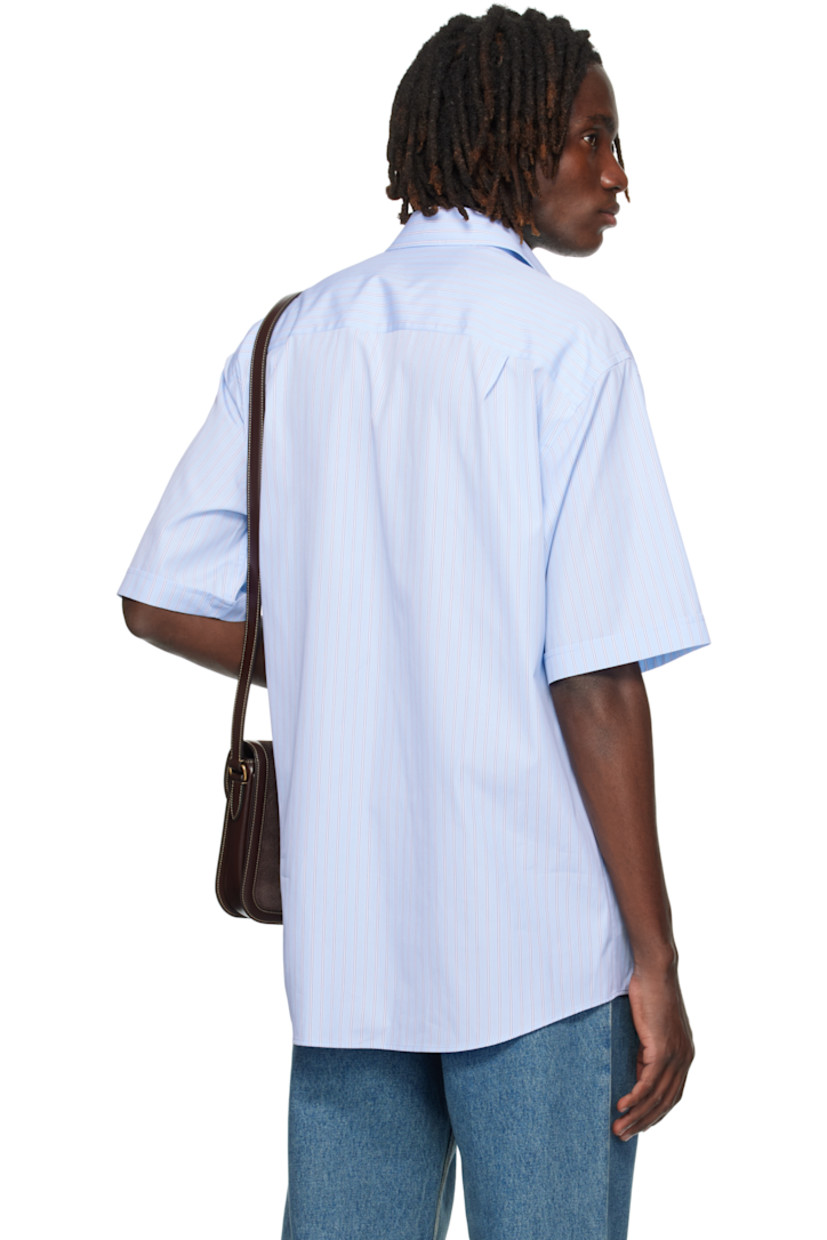 Cotton poplin shirt.

· Stripes throughout
· Spread collar
· Button closure
· Logo-embroidered patch pocket at chest
· Shirttail hem
· Pleats at back yoke

Supplier color: Sky blue