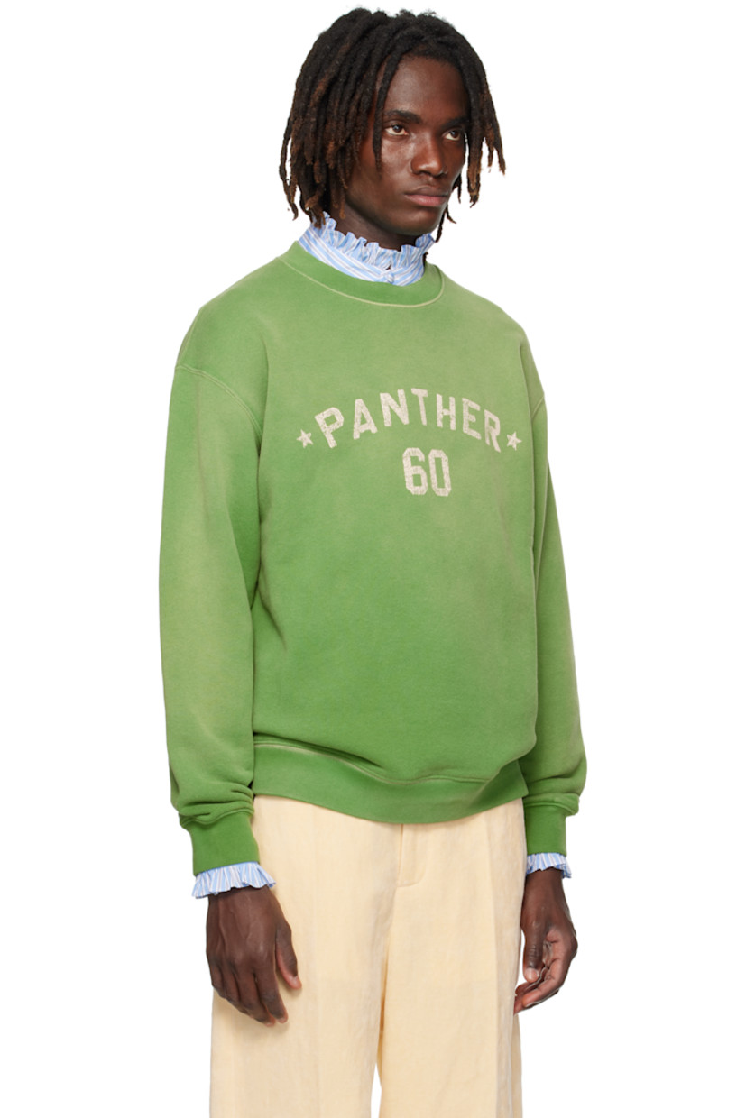 Cotton French terry sweatshirt.

· Fading throughout
· Rib-knit crewneck, hem, and cuffs
· Text printed at chest
· Dropped shoulders
· Logo appliqués at back

Supplier color: Laurel