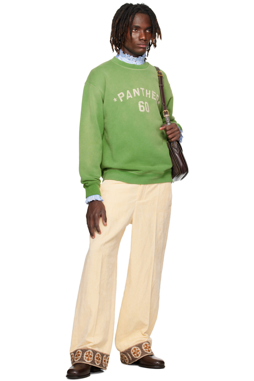 Cotton French terry sweatshirt.

· Fading throughout
· Rib-knit crewneck, hem, and cuffs
· Text printed at chest
· Dropped shoulders
· Logo appliqués at back

Supplier color: Laurel