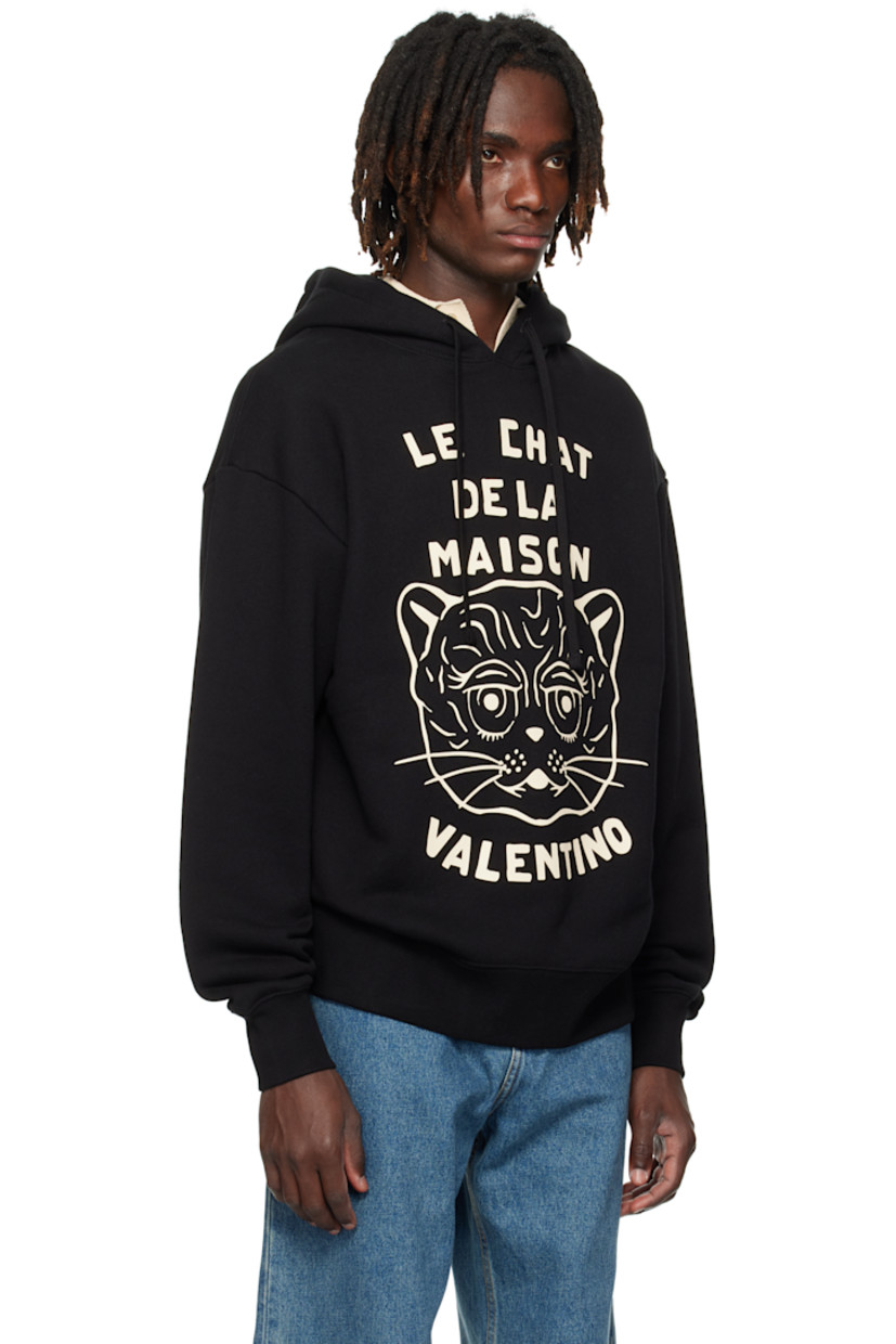 French terry hoodie.

· Drawstring at hood
· Text, graphic, and logo printed at front
· Kangaroo pocket at waist
· Rib-knit hem and cuffs
· Dropped shoulders

Supplier color: Black/Butter