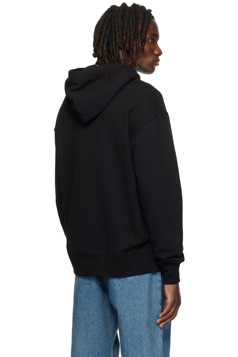 French terry hoodie.

· Drawstring at hood
· Text, graphic, and logo printed at front
· Kangaroo pocket at waist
· Rib-knit hem and cuffs
· Dropped shoulders

Supplier color: Black/Butter