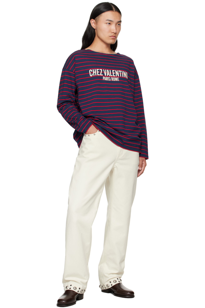 Cotton jersey T-shirt.

· Stripes throughout
· Scoop neck
· Logo and text printed at chest
· Vented side seams
· Dropped shoulders

Supplier color: Grandla/Carminio