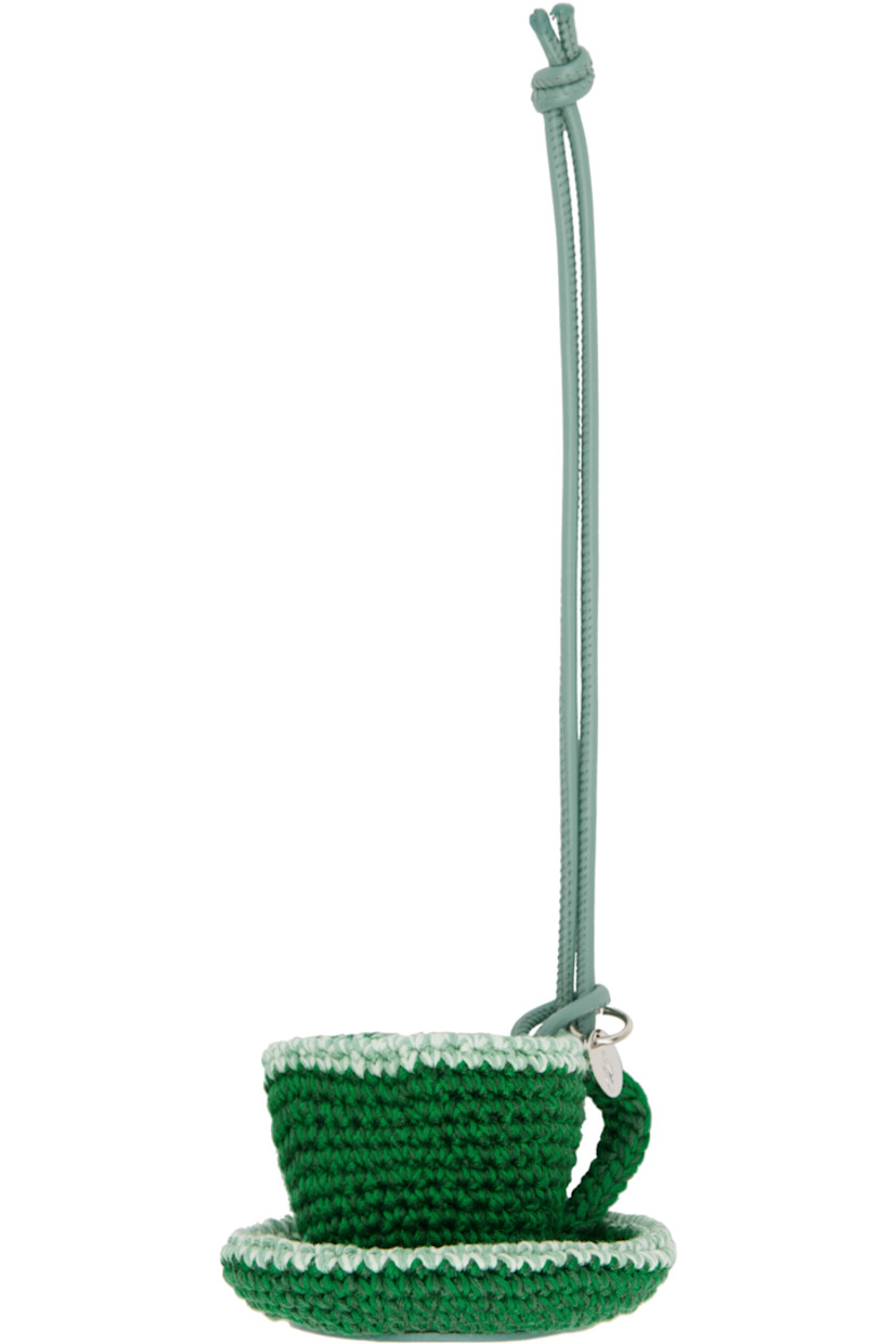 Grained calfskin keychain.

· Crocheted cotton graphic charm with logo disc 
· Logo-embossed calfskin trim at base 
· H9.5" x W3" x D2"

Supplier color: Green