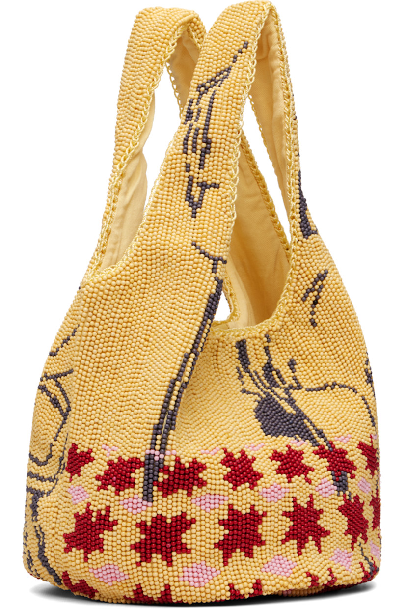 Beaded tote. 

· Graphic pattern throughout
· Integrated carry handles
· Magnetic press-stud closure 
· Cotton twill lining
· H7" x W12" x D8"

Supplier color: Multi