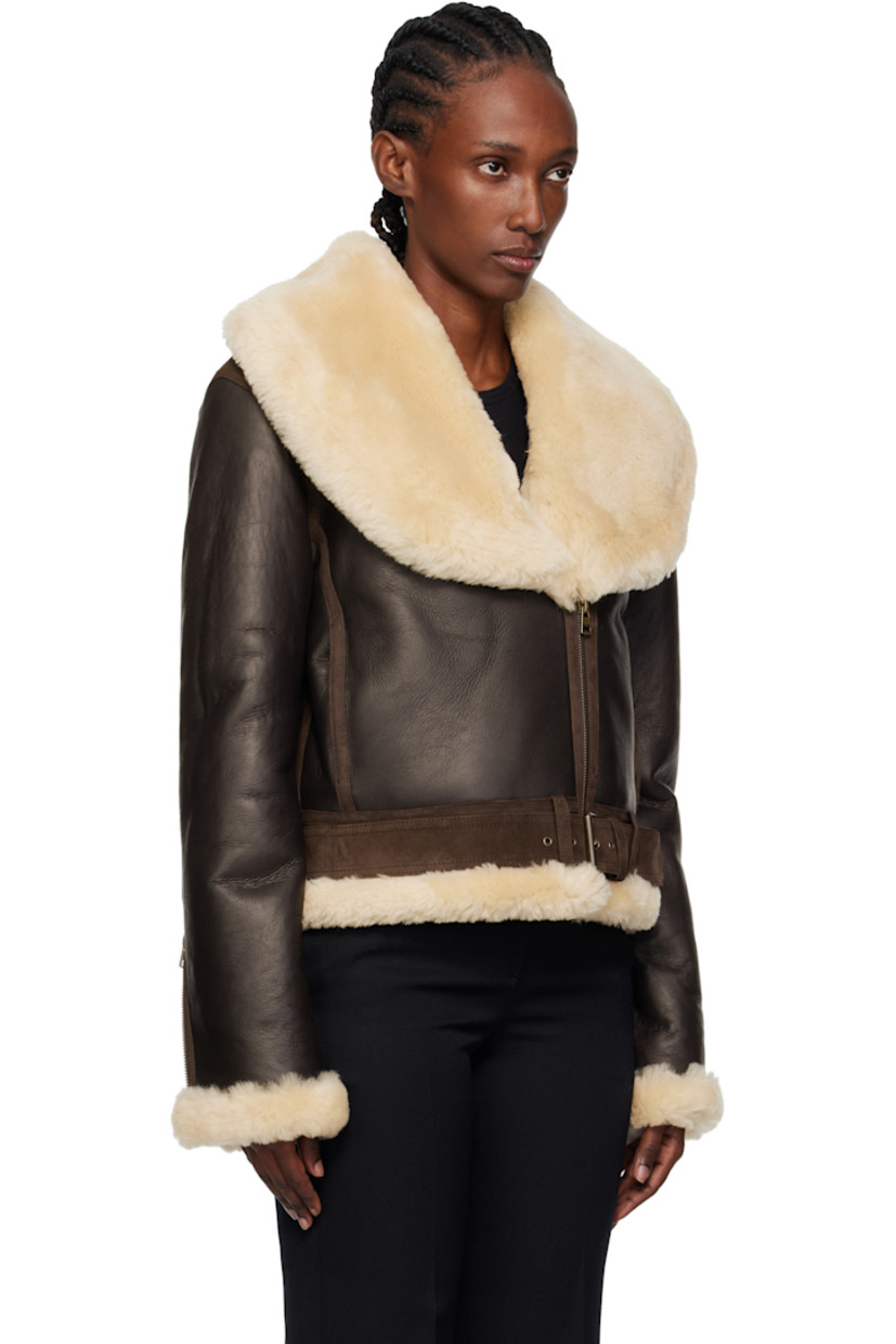 Grained sheepskin jacket.

· Sheepskin suede trim throughout
· Shearling trim at shawl collar, hem, and cuffs
· Zip closure
· Seam pockets
· Pin-buckle fastening at hem
· Zip expansion panel at cuffs
· Shearling interior

Supplier color: Dark brown
