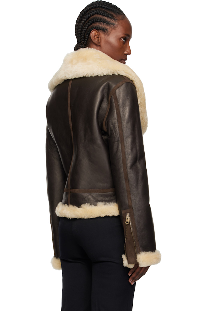 Grained sheepskin jacket.

· Sheepskin suede trim throughout
· Shearling trim at shawl collar, hem, and cuffs
· Zip closure
· Seam pockets
· Pin-buckle fastening at hem
· Zip expansion panel at cuffs
· Shearling interior

Supplier color: Dark brown
