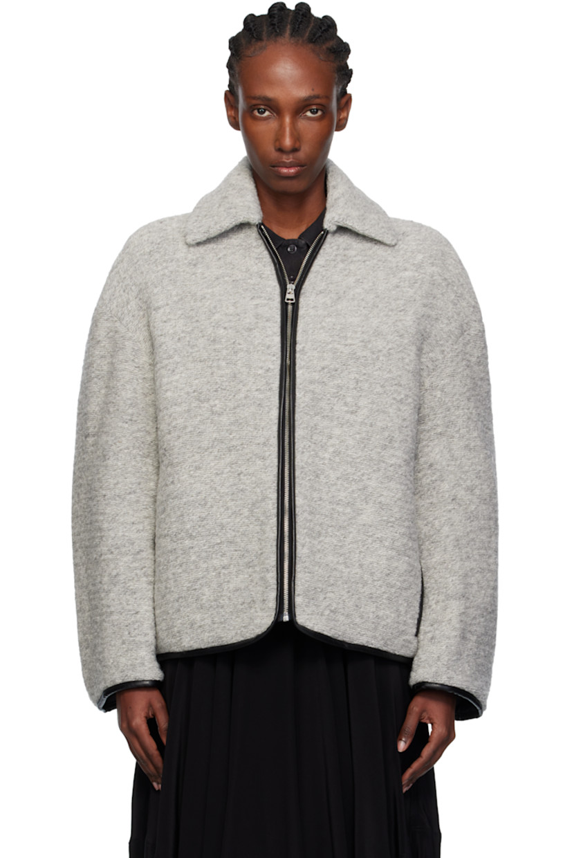 Insulated knit wool-blend jacket. 

· Grained leather trim throughout
· Spread collar
· Zip closure
· Seam pockets at waist 
· Logo patch at back
· Full quilted twill lining

Supplier color: Light grey melange