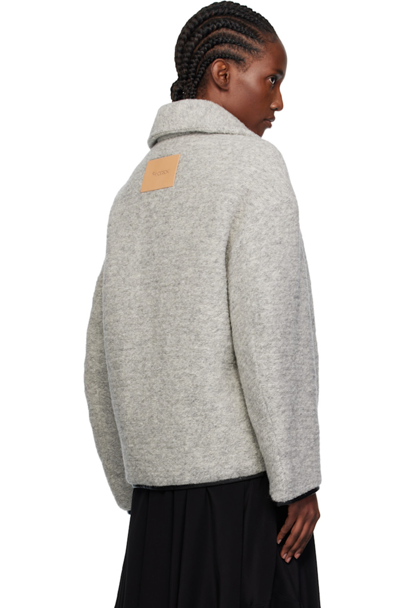 Insulated knit wool-blend jacket. 

· Grained leather trim throughout
· Spread collar
· Zip closure
· Seam pockets at waist 
· Logo patch at back
· Full quilted twill lining

Supplier color: Light grey melange