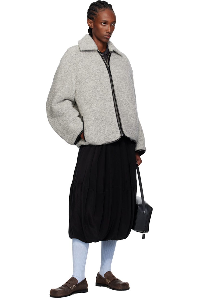 Insulated knit wool-blend jacket. 

· Grained leather trim throughout
· Spread collar
· Zip closure
· Seam pockets at waist 
· Logo patch at back
· Full quilted twill lining

Supplier color: Light grey melange
