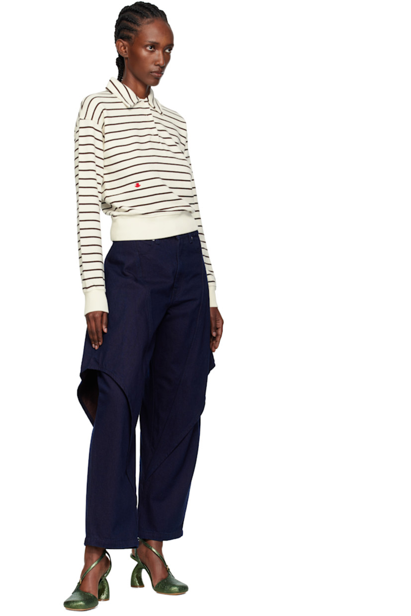 Non-stretch denim jeans.

· Belt loops
· Four-pocket styling
· Zip fly
· Overlay at legs
· Logo patch at back waistband

Supplier color: Blue/Red