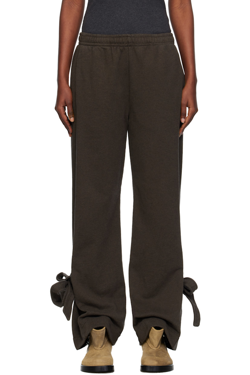 French terry lounge pants.

· Concealed drawstring at elasticized waistband
· Two-pocket styling
· Self-tie fastening at cuffs
· Logo embroidered at back

Supplier color: Dark brown melange