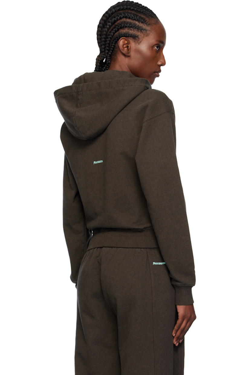 French terry hoodie.

· Drawstring at hood
· Rib-knit hem and cuffs
· Dropped shoulders
· Logo embroidered at back

Supplier color: Dark brown melange