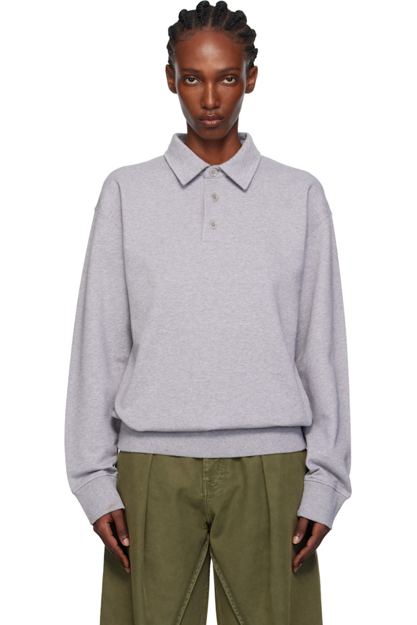 French terry polo.

· Spread collar
· Three-button placket
· Rib-knit hem and cuffs
· Logo embroidered at back collar

Supplier color: Mid grey melange