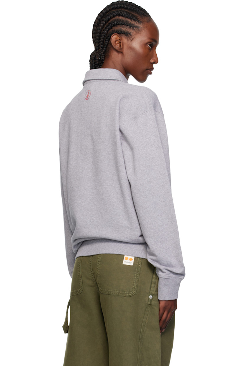 French terry polo.

· Spread collar
· Three-button placket
· Rib-knit hem and cuffs
· Logo embroidered at back collar

Supplier color: Mid grey melange