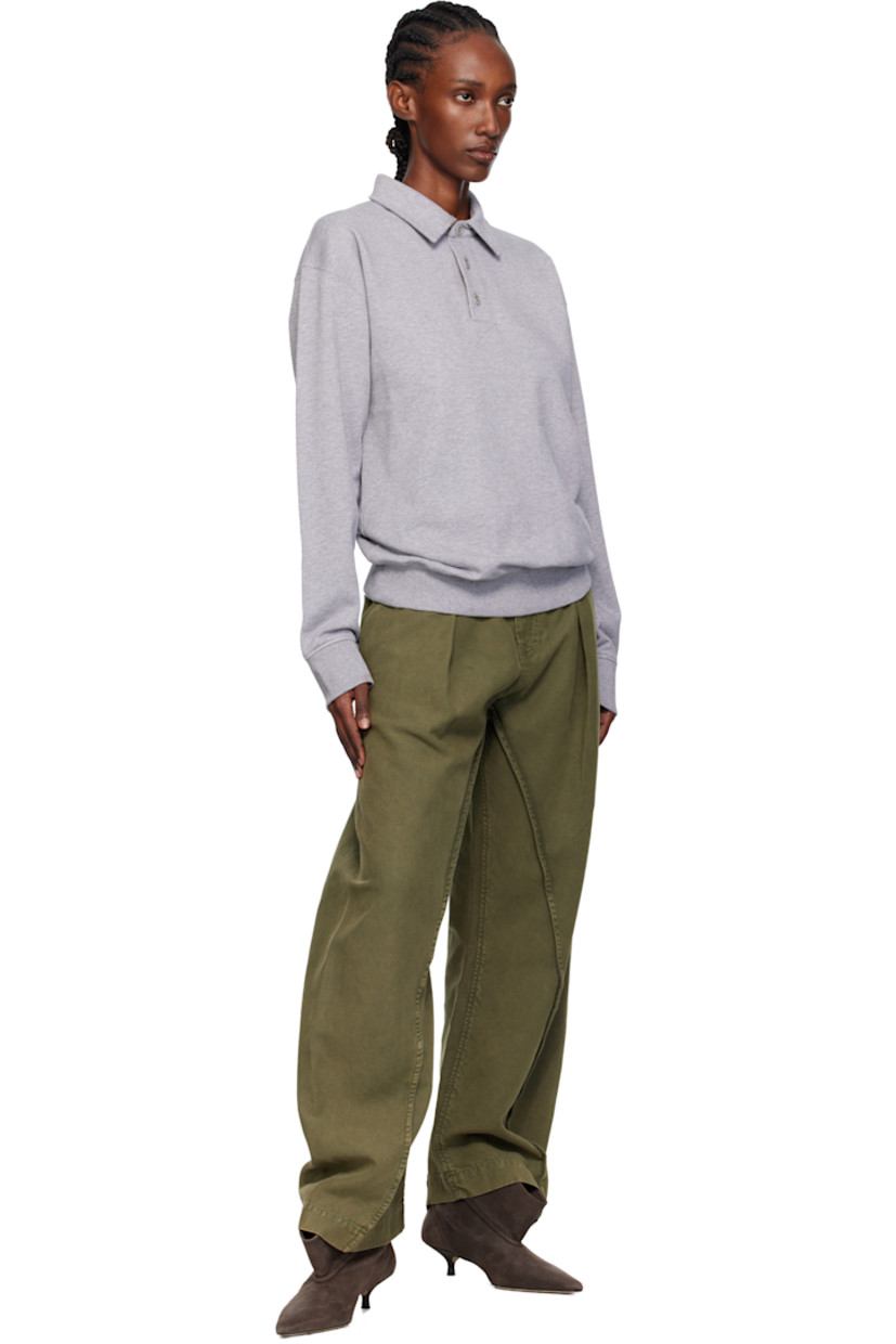 French terry polo.

· Spread collar
· Three-button placket
· Rib-knit hem and cuffs
· Logo embroidered at back collar

Supplier color: Mid grey melange