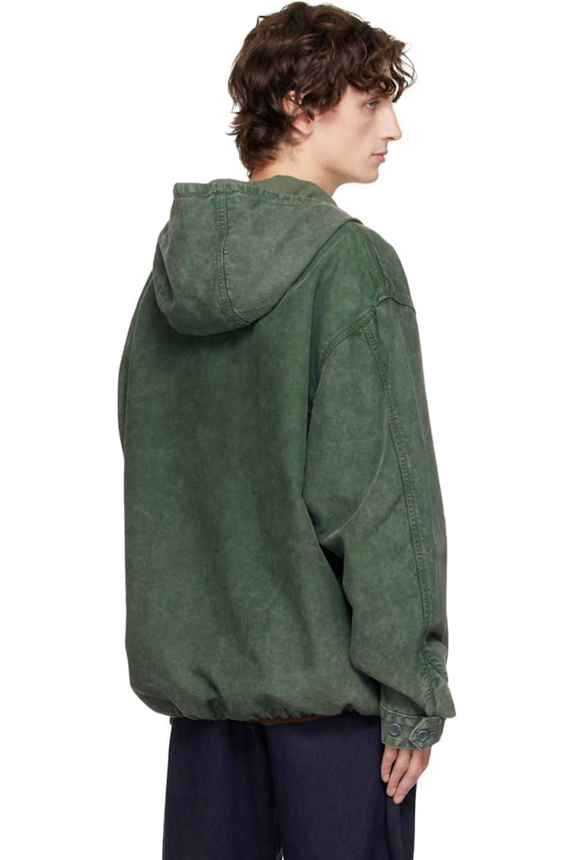 Cotton twill jacket. 

· Garment-dyed
· Drawstring at hood
· Half-zip closure
· Zip pocket at chest
· Logo embroidered at front hem 
· Bungee-style drawstring at hem 
· Dropped shoulders
· Buttoned barrel cuffs

Supplier color: Pine