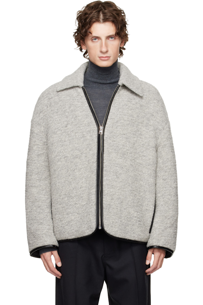 Insulated purl-knit wool- and cotton-blend jacket. 

· Grained leather trim throughout 
· Spread collar 
· Zip closure 
· Welt pockets at chest
· Dropped shoulders 
· Logo patch at back collar 
· Patch pocket at interior 
· Full quilted twill lining 

Supplier color: Light grey melange