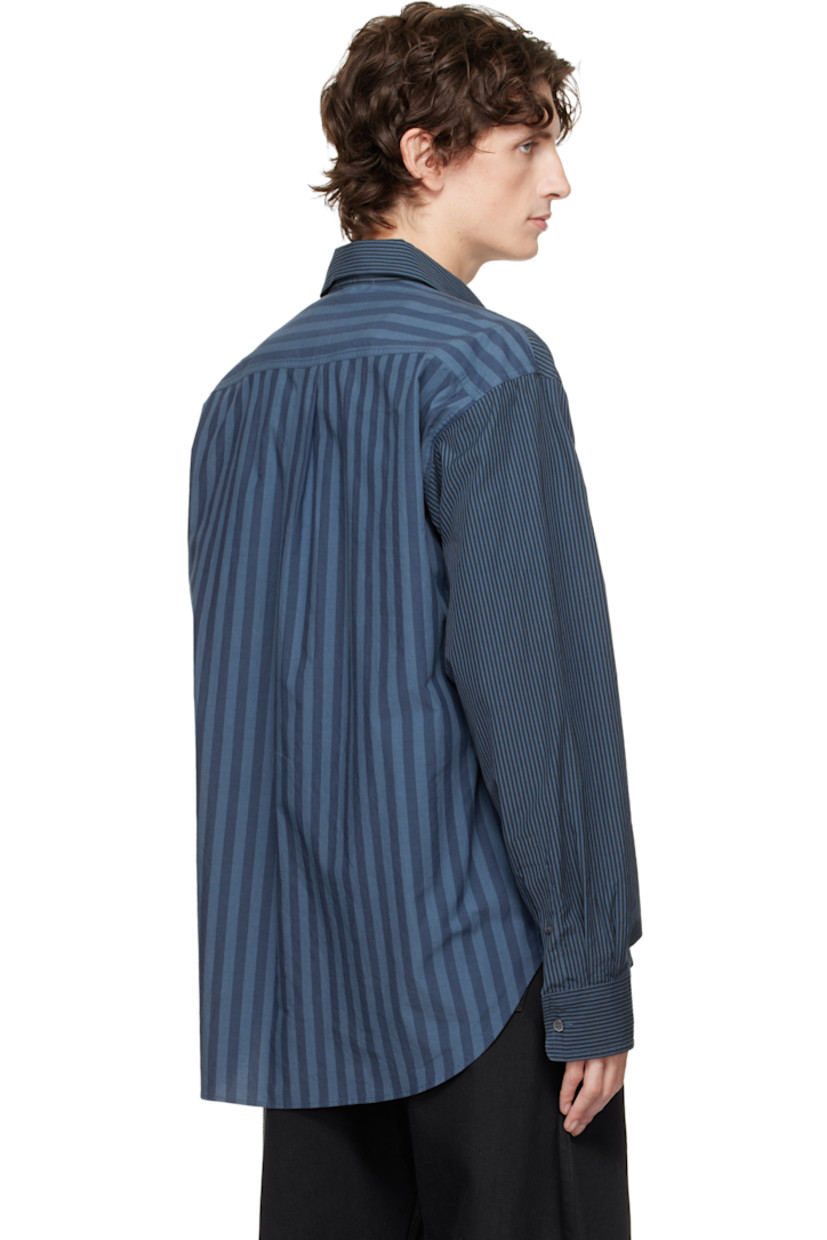 Woven cotton shirt.

· Paneled construction 
· Stripes throughout 
· Spread collar 
· Button closure 
· Patch pocket at chest
· Shirttail hem 
· Pleats at buttoned barrel cuffs
· Logo embroidered at cuff
· Box pleat at back yoke 

Supplier color: Navy