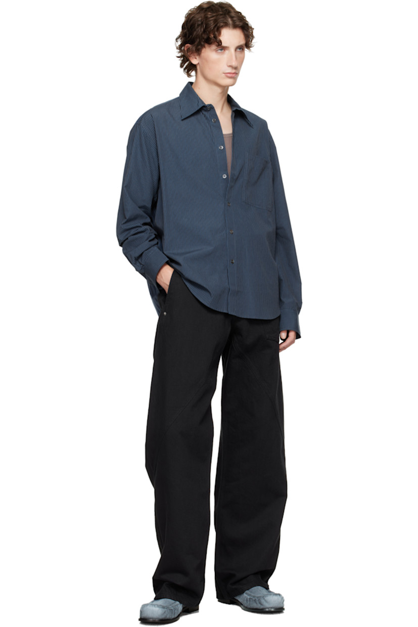 Woven cotton shirt.

· Paneled construction 
· Stripes throughout 
· Spread collar 
· Button closure 
· Patch pocket at chest
· Shirttail hem 
· Pleats at buttoned barrel cuffs
· Logo embroidered at cuff
· Box pleat at back yoke 

Supplier color: Navy