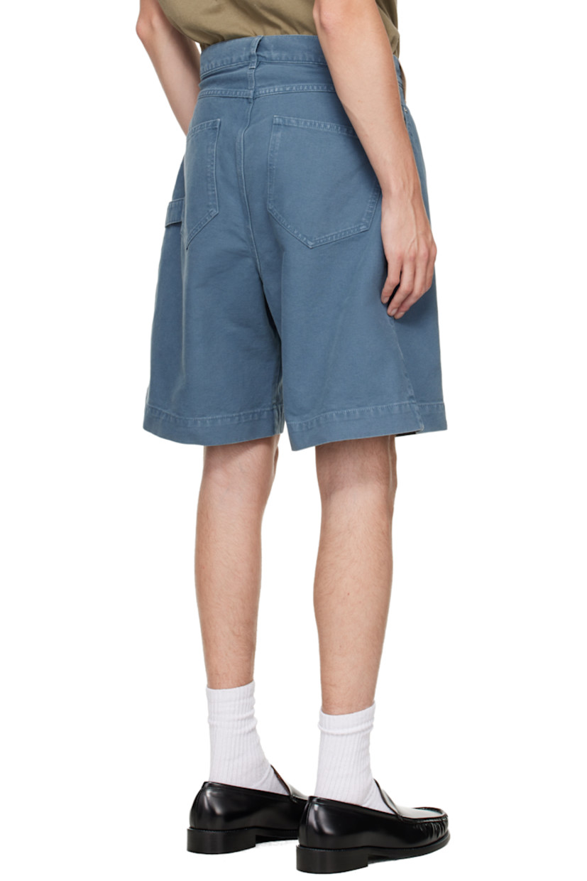 Non-stretch denim shorts.

· Asymmetrical construction 
· Fading and whiskering throughout
· Belt loops
· Four-pocket styling
· Zip fly
· Logo patch at front waistband
· Logo embroidered at front 

Supplier color: Steel blue