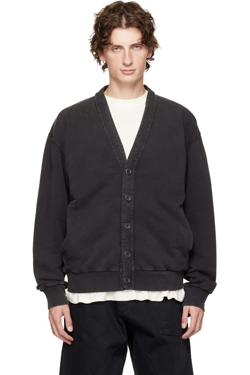 French terry cardigan. 

· Garment-dyed
· Y-neck 
· Button closure
· Seam pockets at waist 
· Rib-knit hem and cuffs
· Dropped shoulders
· Logo embroidered at back hem

Supplier color: Washed black