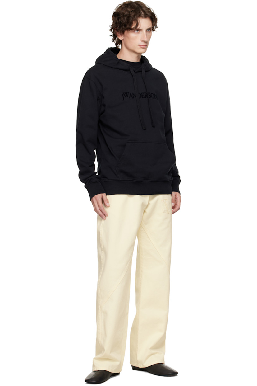 French terry hoodie. 

· Drawstring at hood
· Flocked logo at chest
· Kangaroo pocket at waist
· Rib-knit hem and cuffs
· Dropped shoulders

Supplier color: Black