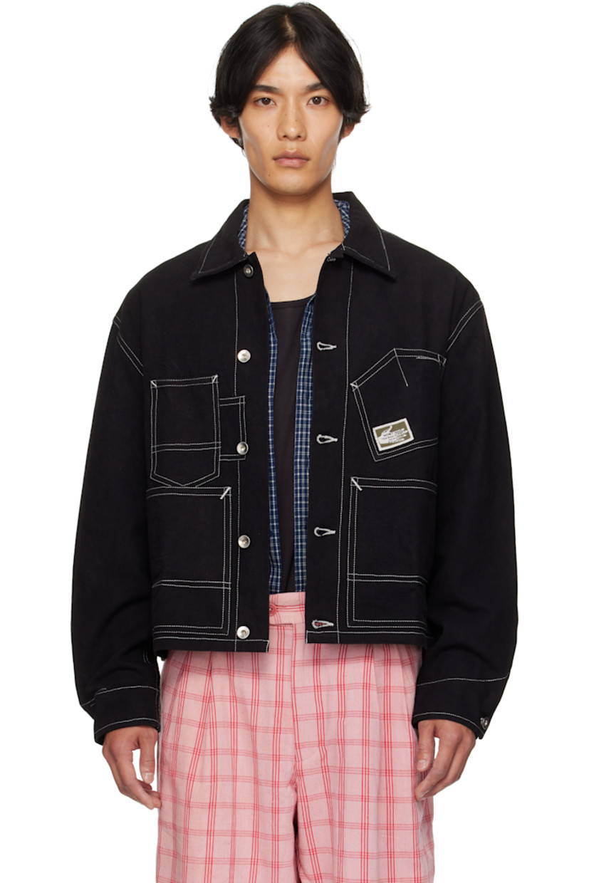 Kaduka-dyed non-stretch organic cotton denim jacket.

· Off-set stitching detailing throughout
· Spread collar
· Button closure
· Logo patch at chest
· Patch pockets at chest and waist
· Raw-edge patch at back hem
· Button barrel cuffs
· Silver-tone hardware
· Contrast stitching in white

Part of the Wonky-Wear capsule.

Supplier color: Black Wonky-Wear
