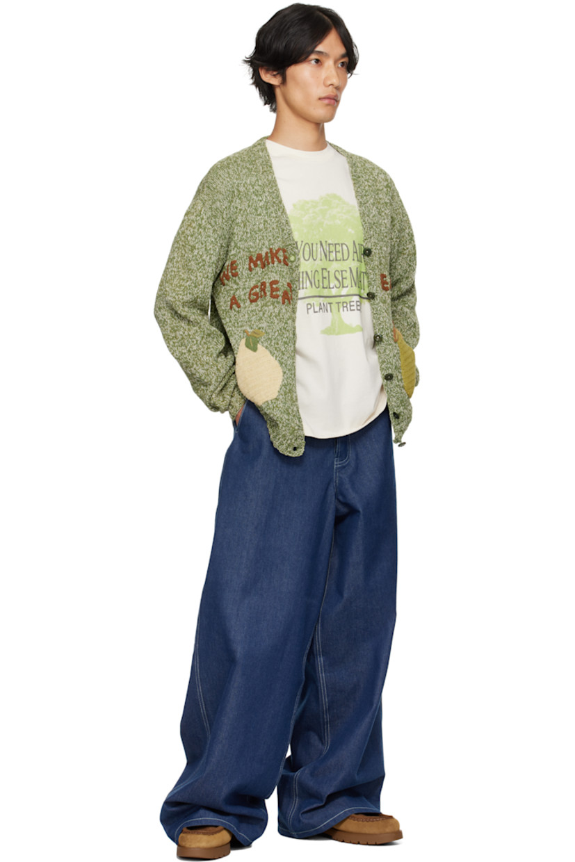 Natural dyed hand-knit organic cotton cardigan.  Dyed with natural indigo, pomegranate, kaduka, palapattai and karuvelam pattai bark, and sevilokodi flower.

· V-neck
· Button closure
· Hand-crocheted graphics at front
· Stitched logo at front hem
· Corozo hardware

Supplier color: Green Pears