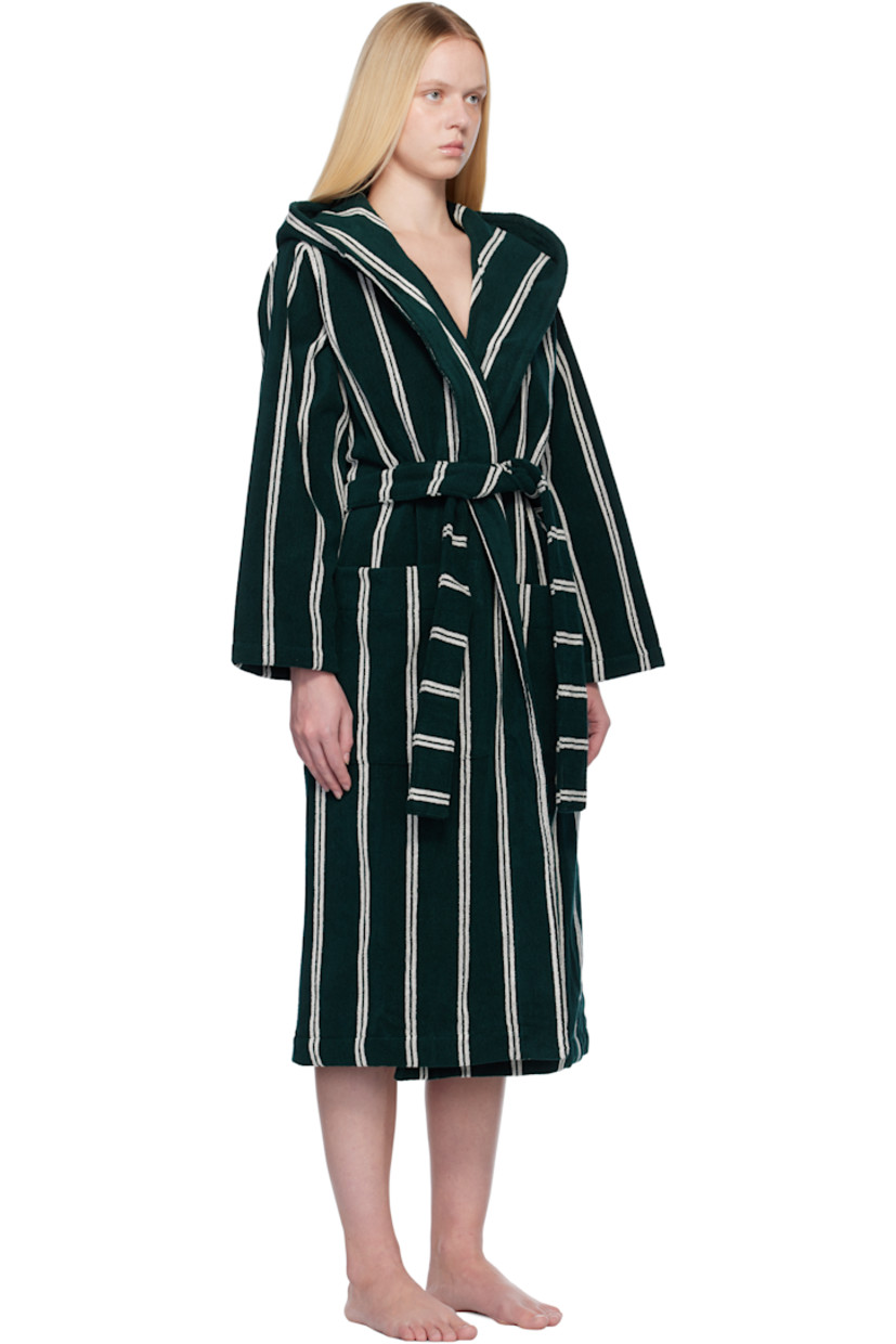 Heavyweight 385 gsm organic cotton terrycloth bathrobe. Stripes throughout.

· Certified GOTS and OEKO-TEX® Standard 100
· Hood at shawl lapel
· Open front
· Belt loops and detachable self-tie belt
· Patch pockets
· Logo flag at side seam
· Locker loop at inner collar

Supplier color: Forest green stripes
