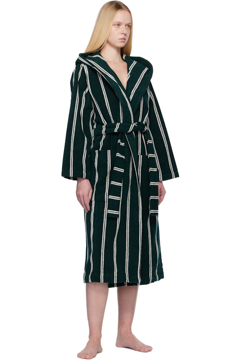Heavyweight 385 gsm organic cotton terrycloth bathrobe. Stripes throughout.

· Certified GOTS and OEKO-TEX® Standard 100
· Hood at shawl lapel
· Open front
· Belt loops and detachable self-tie belt
· Patch pockets
· Logo flag at side seam
· Locker loop at inner collar

Supplier color: Forest green stripes