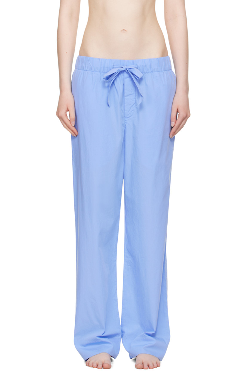 Lightweight organic cotton poplin pyjama pants. 

· Certified OEKO-TEX® Standard 100
· Straight-leg and loose-fit 
· Stonewashed
· Drawstring at elasticized waistband
· Three-pocket styling
· Button fly
· Logo patch at back pocket
· French seams at interior
· Mother-of-pearl hardware

Supplier color: Cornflower blue