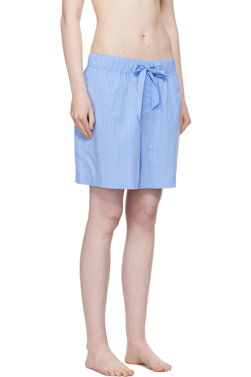 Lightweight organic cotton poplin pyjama shorts. Pinstripes throughout.

· Certified OEKO-TEX® Standard 100
· Wide-leg 
· Stonewashed
· Drawstring at elasticized waistband
· Four-pocket styling
· Button fly
· Logo patch at back pocket
· French seams at interior
· Mother-of-pearl hardware
 
Supplier color: Pin stripes