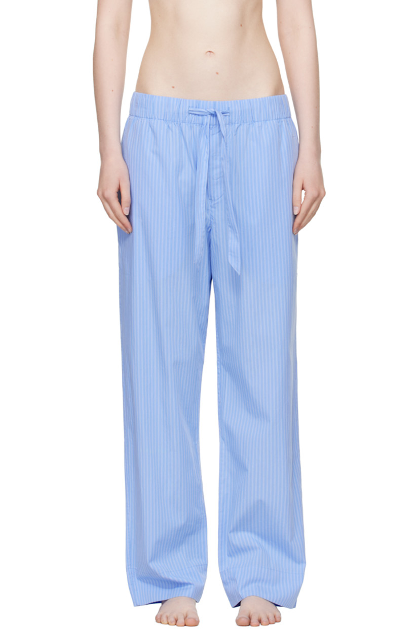 Lightweight organic cotton poplin pyjama pants. Pinstripes throughout. 

· Certified OEKO-TEX® Standard 100
· Straight-leg and loose-fit 
· Stonewashed
· Drawstring at elasticized waistband
· Three-pocket styling
· Button fly
· Logo patch at back pocket
· French seams at interior
· Mother-of-pearl hardware

Supplier color: Pin stripes