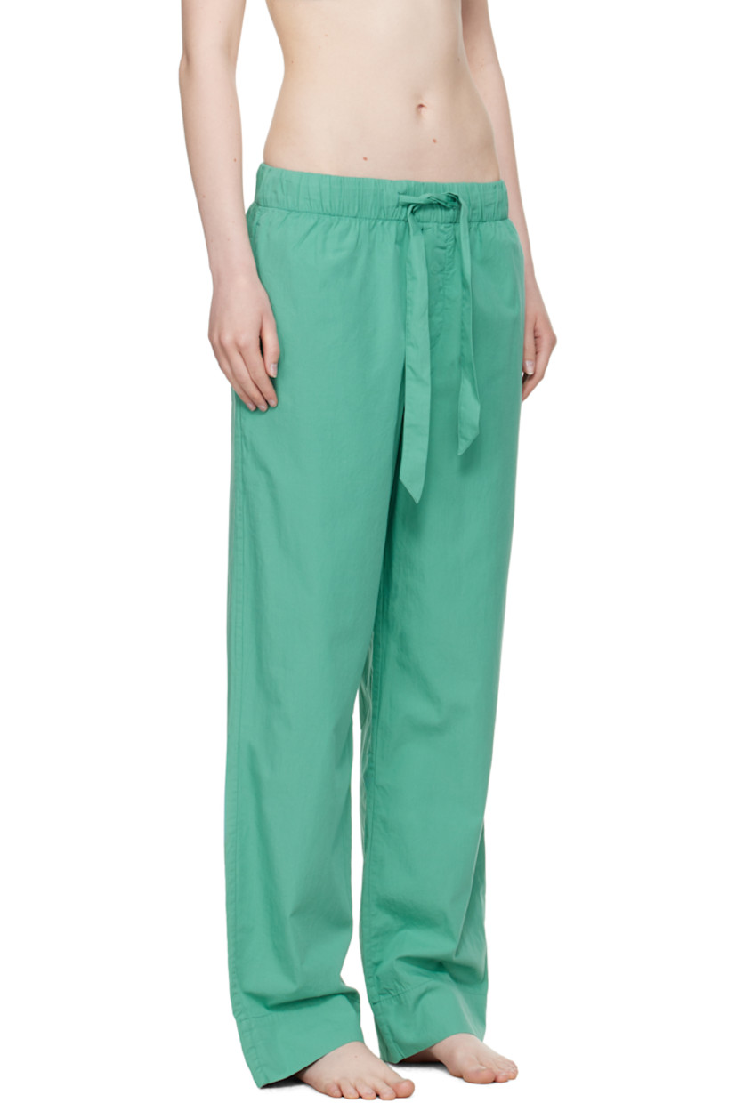 Lightweight organic cotton poplin pyjama pants. 

· Certified OEKO-TEX® Standard 100
· Straight-leg and loose-fit 
· Stonewashed
· Drawstring at elasticized waistband
· Three-pocket styling
· Button fly
· Logo patch at back pocket
· French seams at interior
· Mother-of-pearl hardware

Supplier color: Vintage green