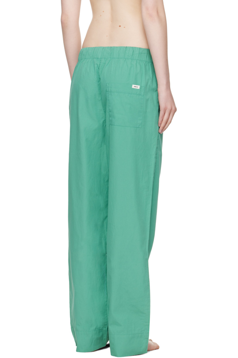 Lightweight organic cotton poplin pyjama pants. 

· Certified OEKO-TEX® Standard 100
· Straight-leg and loose-fit 
· Stonewashed
· Drawstring at elasticized waistband
· Three-pocket styling
· Button fly
· Logo patch at back pocket
· French seams at interior
· Mother-of-pearl hardware

Supplier color: Vintage green
