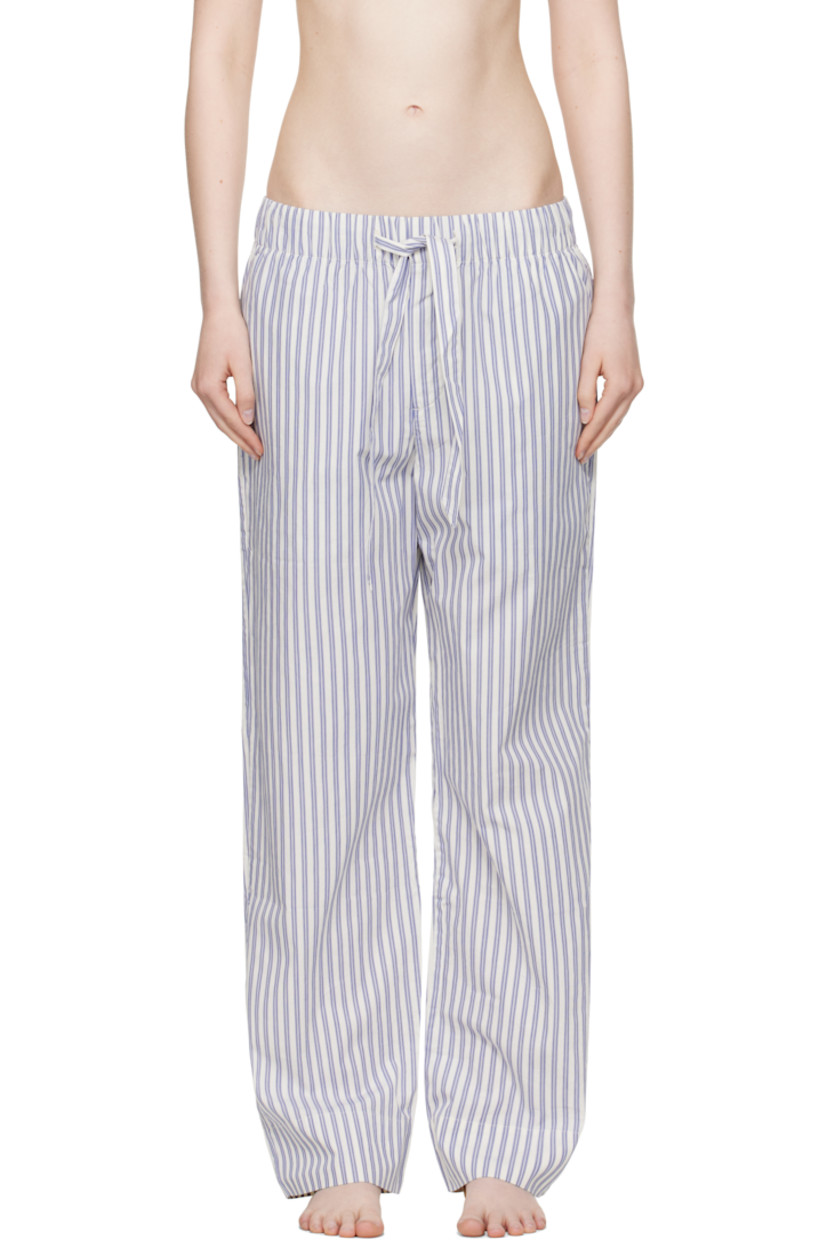 Lightweight organic cotton poplin pyjama pants. Stripes throughout. 

· Certified OEKO-TEX® Standard 100
· Straight-leg and loose-fit 
· Stonewashed
· Drawstring at elasticized waistband
· Three-pocket styling
· Button fly
· Logo patch at back pocket
· French seams at interior
· Mother-of-pearl hardware

Supplier color: Skagen stripes