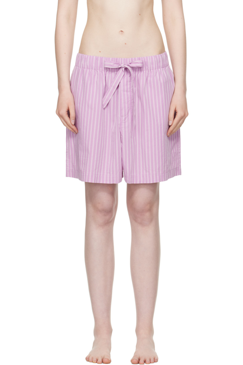 Lightweight organic cotton poplin pyjama shorts. Stripes throughout. 

· Certified OEKO-TEX® Standard 100
· Wide-leg 
· Stonewashed
· Drawstring at elasticized waistband
· Four-pocket styling
· Button fly
· Logo patch at back pocket
· French seams at interior
· Mother-of-pearl hardware
 
Supplier color: Purple pink stripes