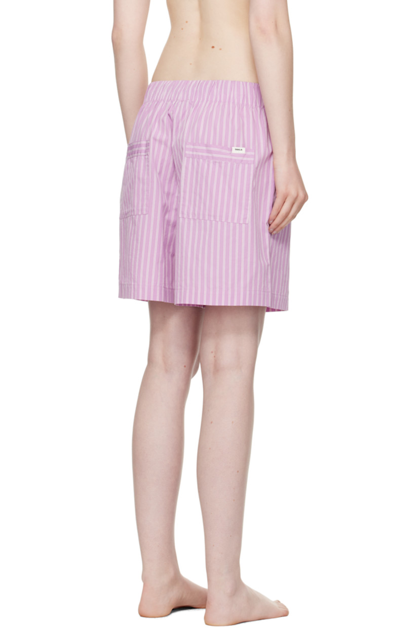 Lightweight organic cotton poplin pyjama shorts. Stripes throughout. 

· Certified OEKO-TEX® Standard 100
· Wide-leg 
· Stonewashed
· Drawstring at elasticized waistband
· Four-pocket styling
· Button fly
· Logo patch at back pocket
· French seams at interior
· Mother-of-pearl hardware
 
Supplier color: Purple pink stripes