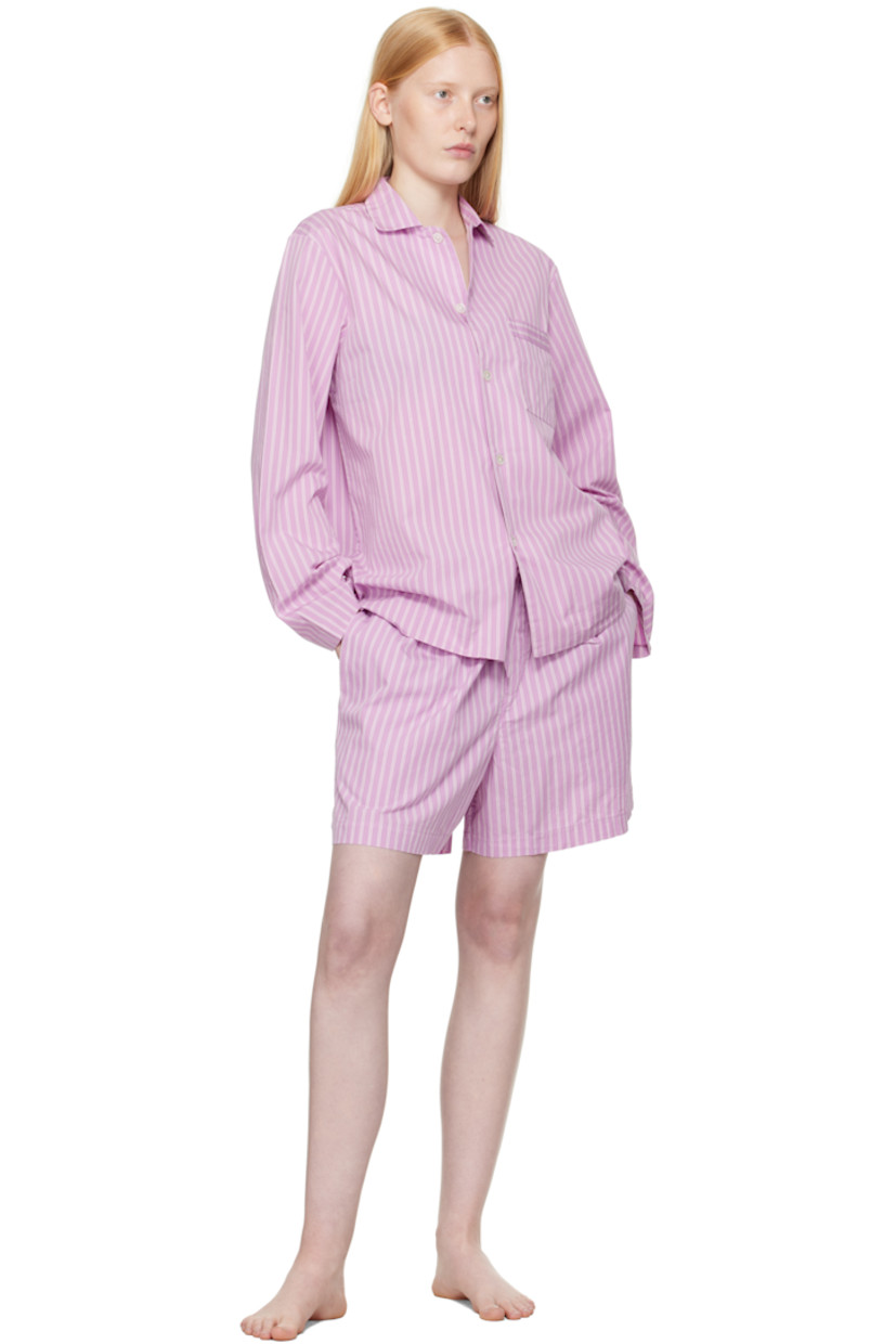 Lightweight organic cotton poplin pyjama shorts. Stripes throughout. 

· Certified OEKO-TEX® Standard 100
· Wide-leg 
· Stonewashed
· Drawstring at elasticized waistband
· Four-pocket styling
· Button fly
· Logo patch at back pocket
· French seams at interior
· Mother-of-pearl hardware
 
Supplier color: Purple pink stripes