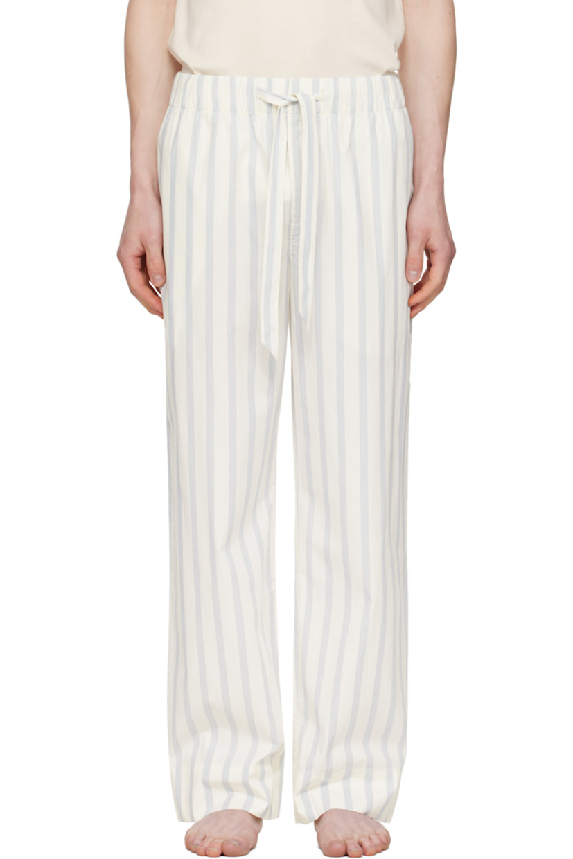 Lightweight organic cotton poplin pyjama pants. Stripes throughout.

· Certified OEKO-TEX® Standard 100
· Straight-leg and loose-fit 
· Stonewashed
· Drawstring at elasticized waistband
· Three-pocket styling
· Button fly
· Logo patch at back pocket
· French seams at interior
· Mother-of-pearl hardware

Supplier color: Needle stripes
