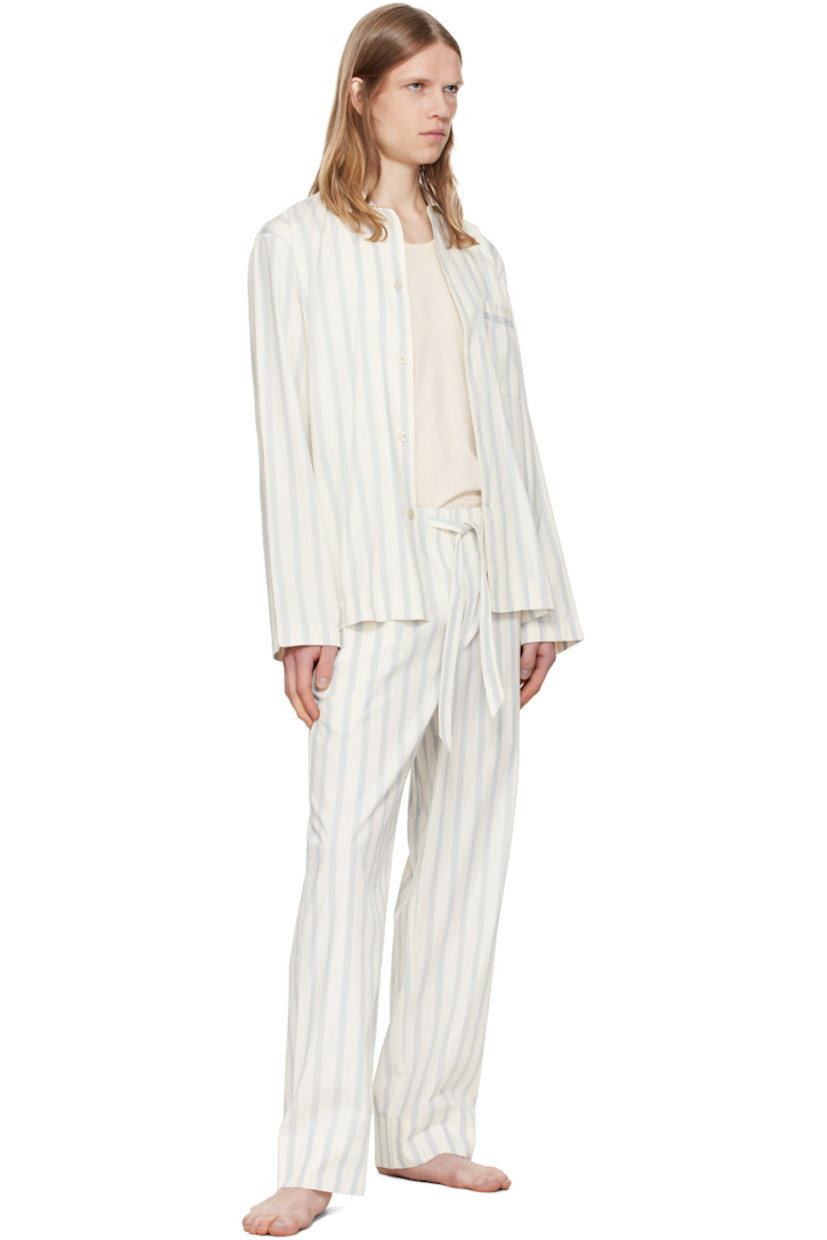 Lightweight organic cotton poplin pyjama pants. Stripes throughout.

· Certified OEKO-TEX® Standard 100
· Straight-leg and loose-fit 
· Stonewashed
· Drawstring at elasticized waistband
· Three-pocket styling
· Button fly
· Logo patch at back pocket
· French seams at interior
· Mother-of-pearl hardware

Supplier color: Needle stripes