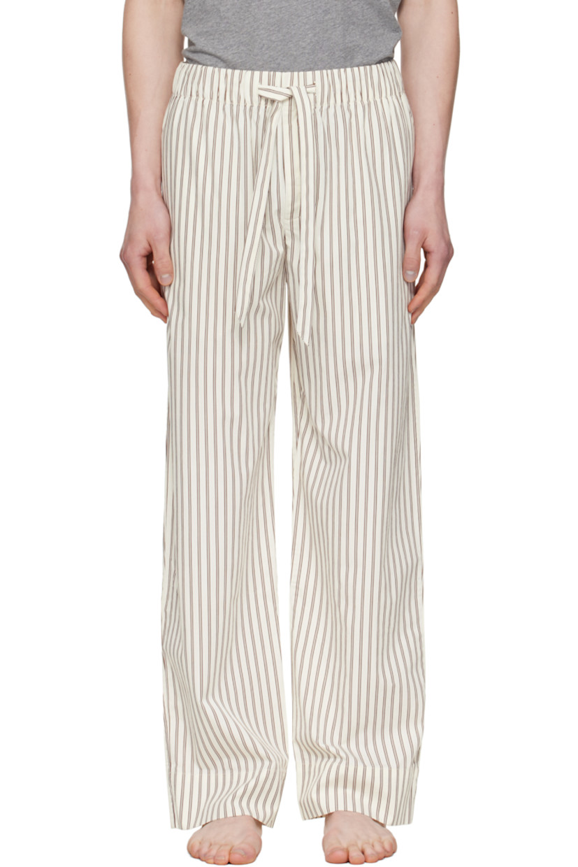 Lightweight organic cotton poplin pyjama pants. Stripes throughout.

· Certified OEKO-TEX® Standard 100
· Straight-leg and loose-fit 
· Stonewashed
· Drawstring at elasticized waistband
· Three-pocket styling
· Button fly
· Logo patch at back pocket
· French seams at interior
· Mother-of-pearl hardware

Supplier color: Hopper stripes