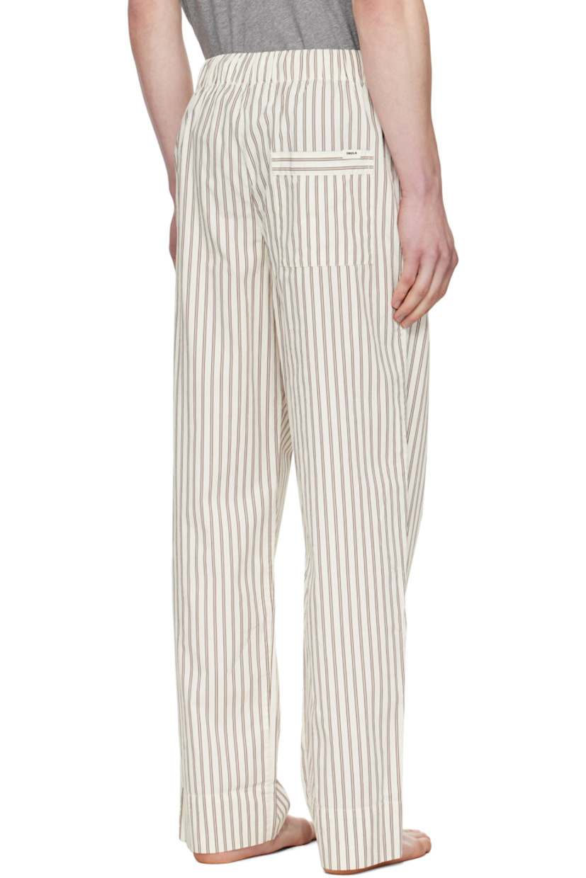Lightweight organic cotton poplin pyjama pants. Stripes throughout.

· Certified OEKO-TEX® Standard 100
· Straight-leg and loose-fit 
· Stonewashed
· Drawstring at elasticized waistband
· Three-pocket styling
· Button fly
· Logo patch at back pocket
· French seams at interior
· Mother-of-pearl hardware

Supplier color: Hopper stripes