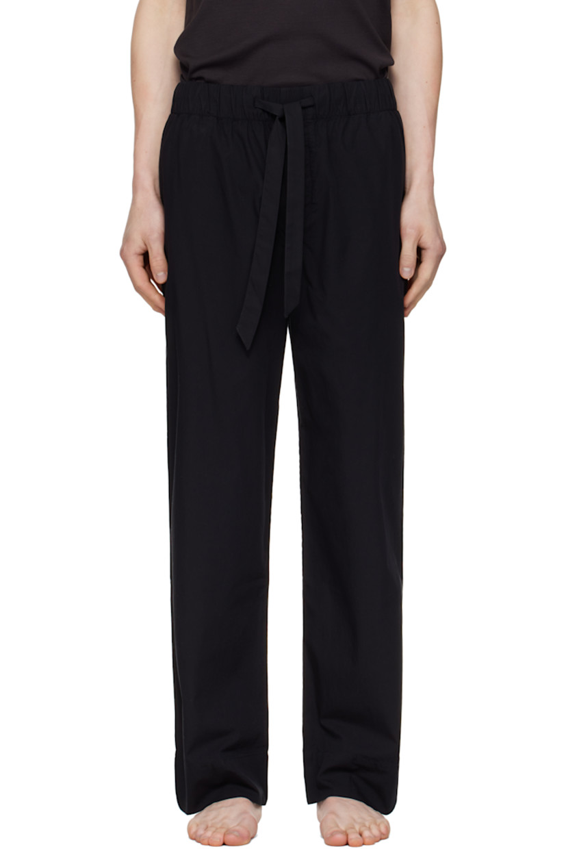Lightweight organic cotton poplin pyjama pants. 

· Certified OEKO-TEX® Standard 100
· Straight-leg and loose-fit 
· Stonewashed
· Drawstring at elasticized waistband
· Three-pocket styling
· Button fly
· Logo patch at back pocket
· French seams at interior
· Mother-of-pearl hardware

Supplier color: All black