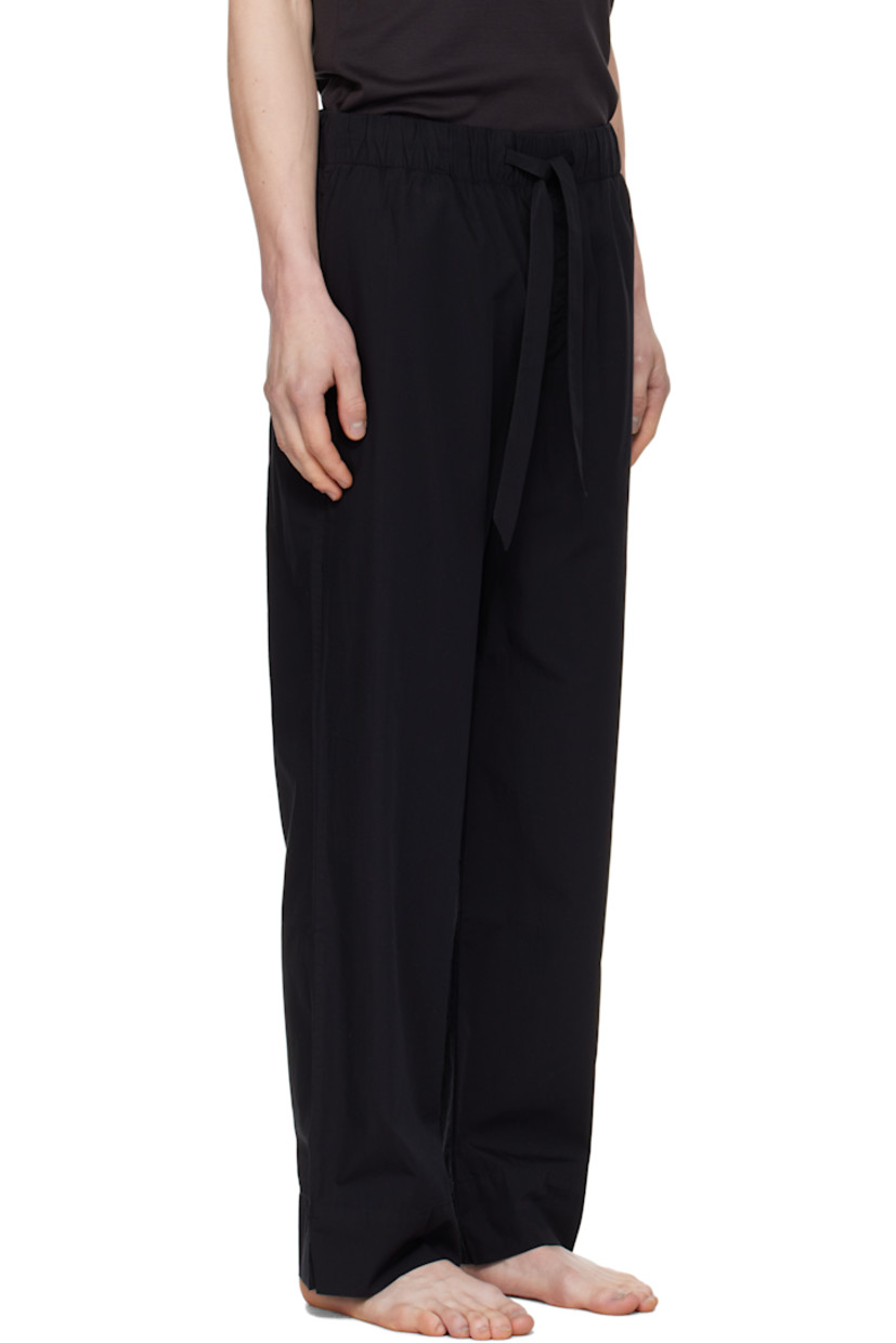 Lightweight organic cotton poplin pyjama pants. 

· Certified OEKO-TEX® Standard 100
· Straight-leg and loose-fit 
· Stonewashed
· Drawstring at elasticized waistband
· Three-pocket styling
· Button fly
· Logo patch at back pocket
· French seams at interior
· Mother-of-pearl hardware

Supplier color: All black