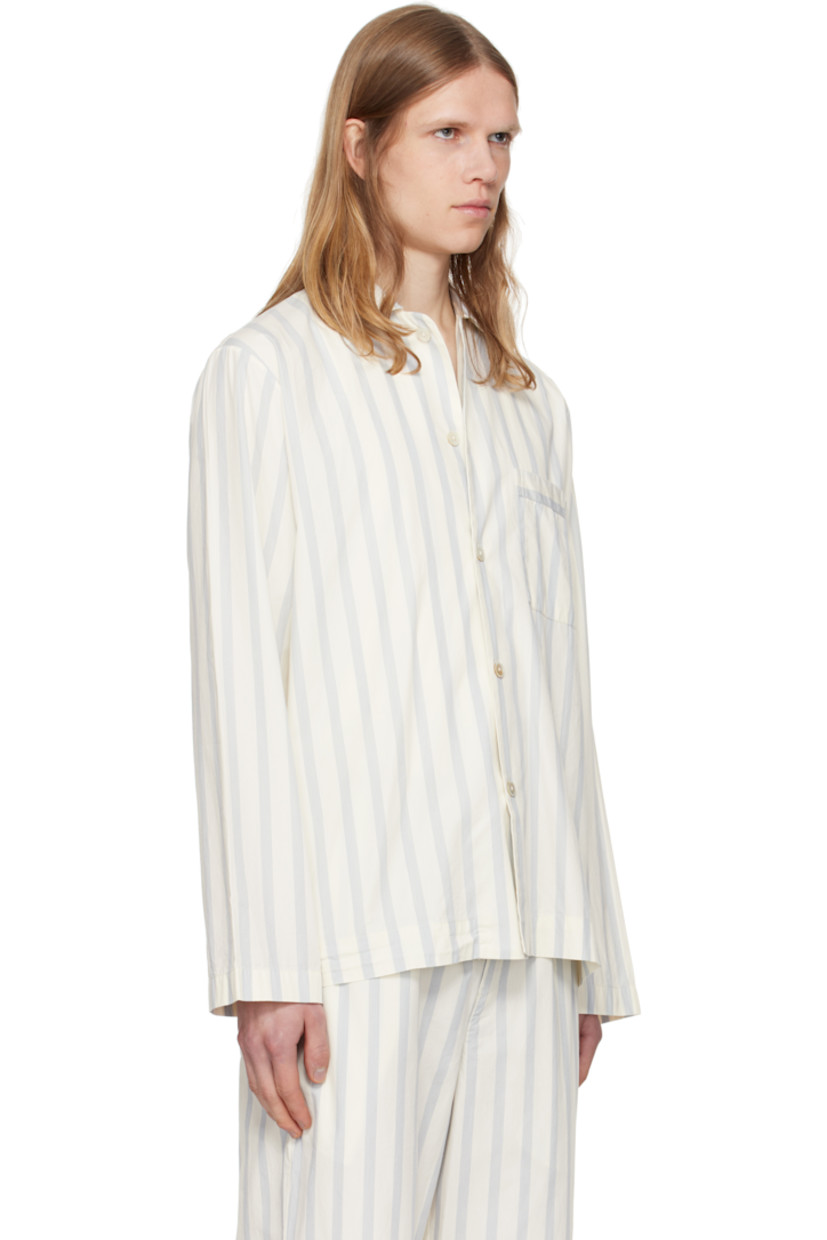 Lightweight organic cotton poplin pyjama shirt. Stripes throughout.

· Certified OEKO-TEX Standard 100
· Stonewashed
· Spread collar
· Button closure
· Patch pocket at chest
· French seams at interior
· Mother-of-pearl hardware

Supplier color: Needle stripes