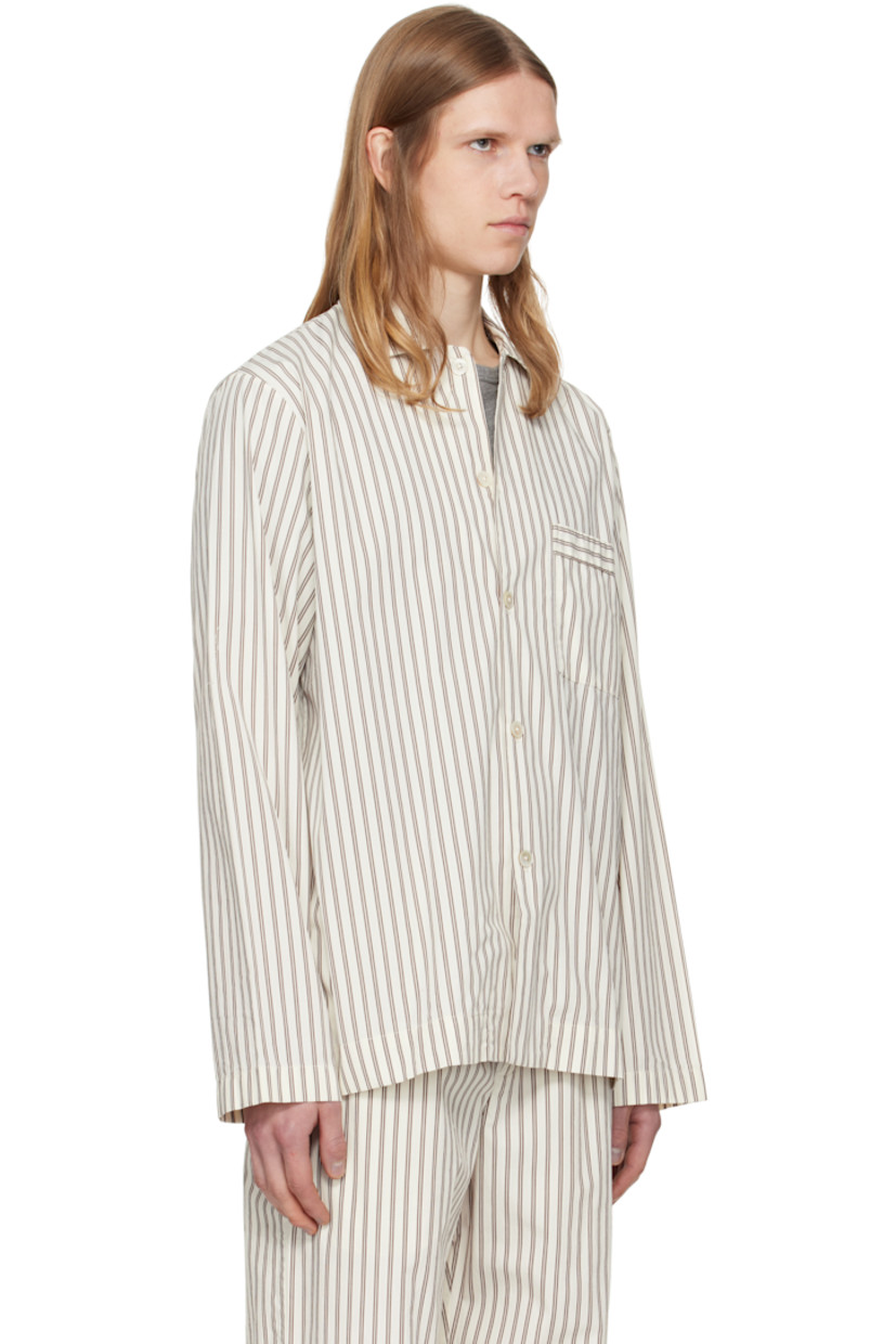 Lightweight organic cotton poplin pyjama shirt. Stripes throughout.

· Certified OEKO-TEX Standard 100
· Stonewashed
· Spread collar
· Button closure
· Patch pocket at chest
· French seams at interior
· Mother-of-pearl hardware

Supplier color: Hopper stripes
